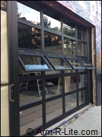Commercial Overhead Garage Doors in New York City Crank Out Windows