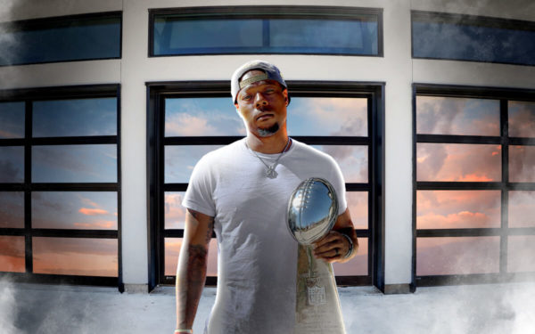 NFL Superstar Teddy Williams Jr Chooses ArmRLite's Modern Glass Garage Doors