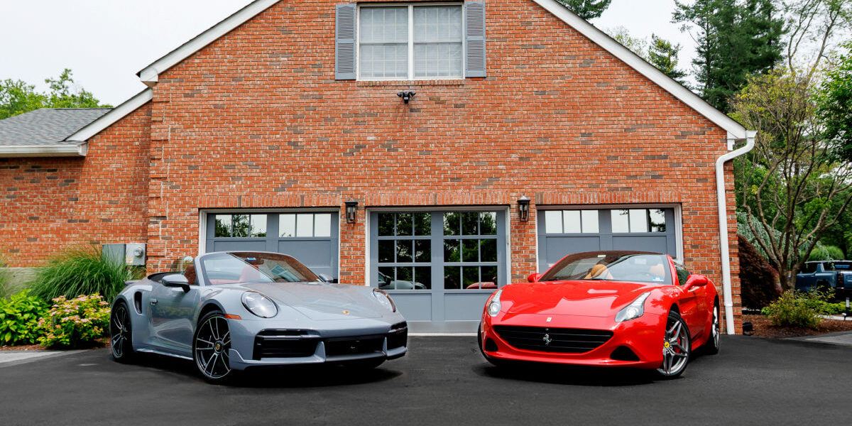 Custom ArmRLite aluminum garage doors color-matched to luxury cars, showcasing premium design and durability.